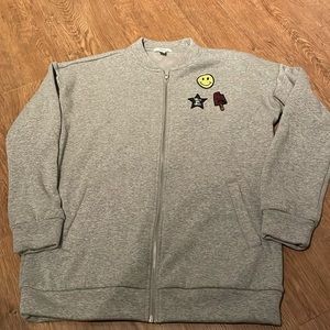 Grey zip up sweater with patches